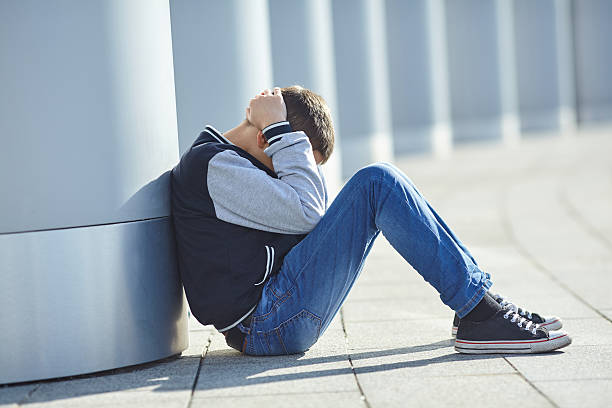 istock little boy crying on the street 626096710