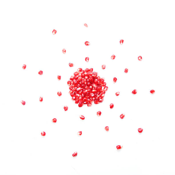 istock pomegranate seeds in shape of sun 626098520