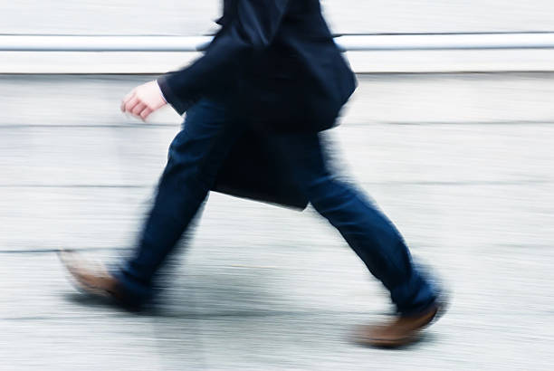 istock businessman walking in a street 626099226