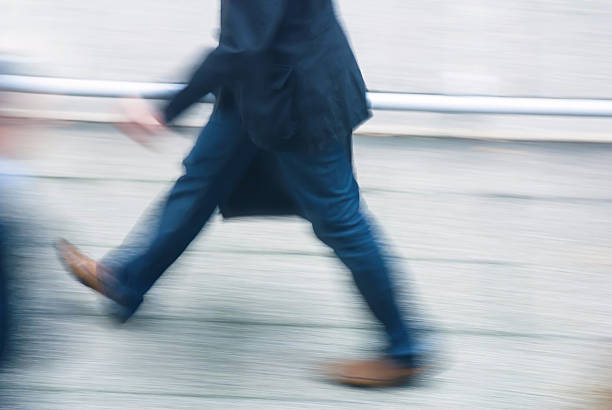 istock businessman walking in a street 626099314