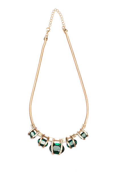 istock Pendant with green stones isolated on white 626104476