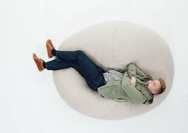istock Above view of man sleeping on bean bag 626105626