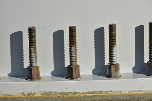 base section and foundation with large bolts of wind turbine.