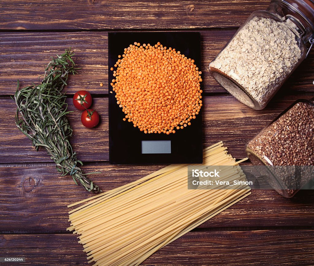 cooking ingredients on the table cooking ingredients lying on the brown wooden table Pasta Stock Photo