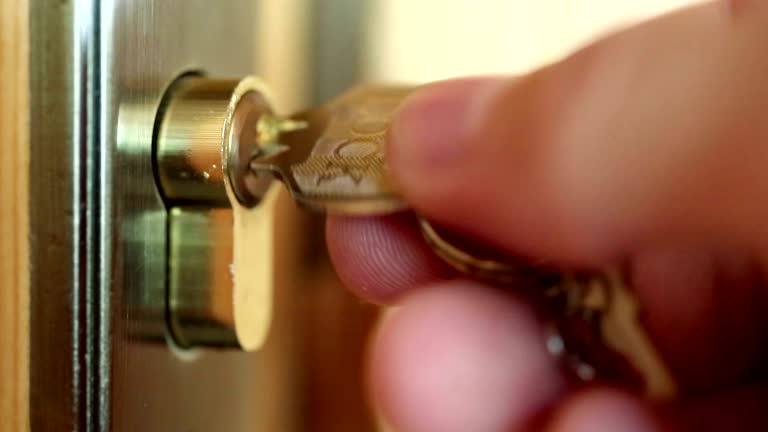 Man closes door  to the key