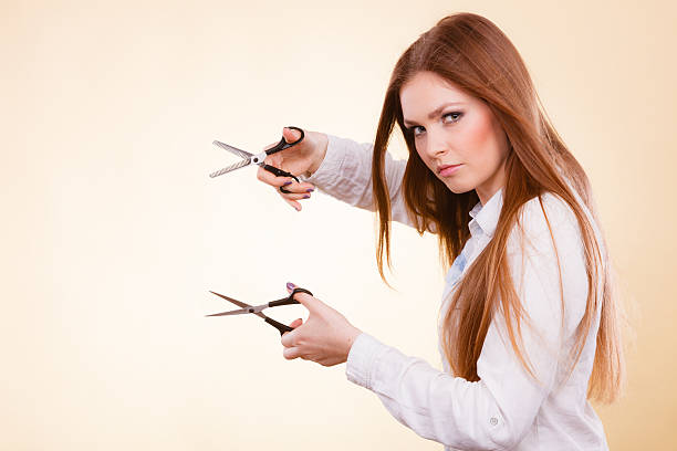 istock Female barber with trimmers scissors. 626132604