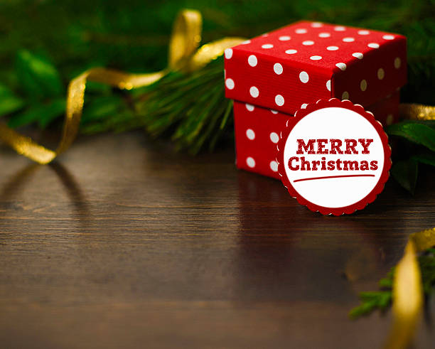 istock Holiday background with gift, real greenery and message 626132972