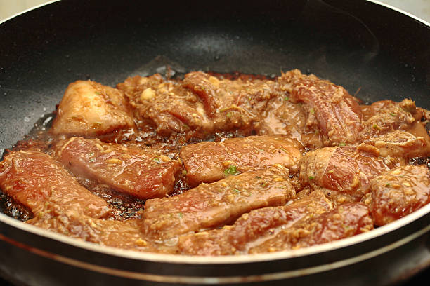 istock Cooking grilled pork with mixed herb served.  Selective focus. 626133608