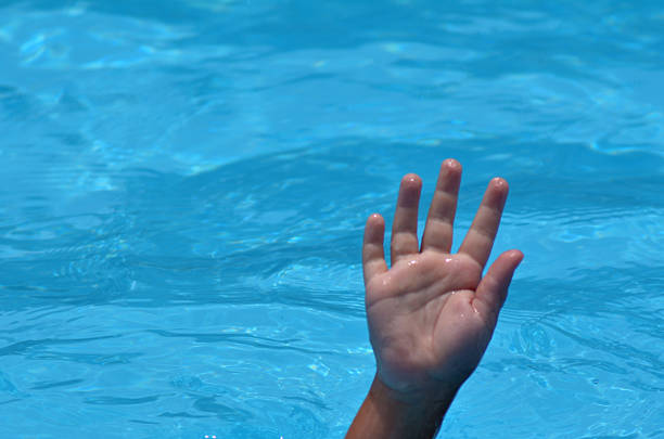 istock Hand of a drowning child 626135636