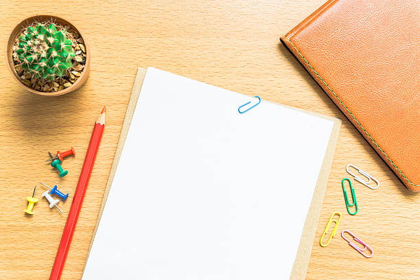 istock Blank white paper and colored pencil on the desk. 626135784
