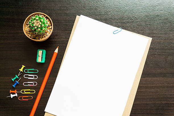 istock Blank white paper and colored pencil on the desk. 626136094