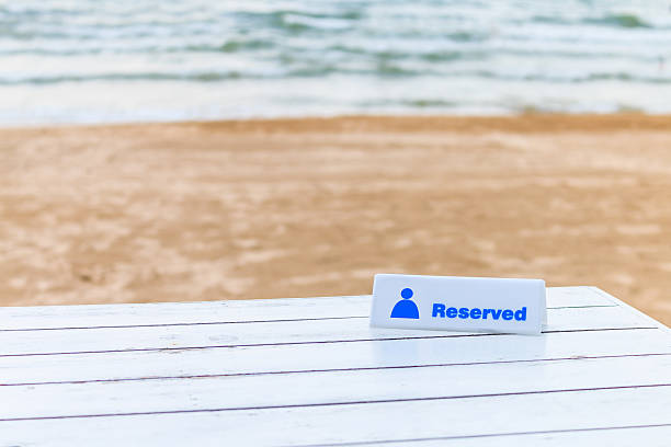 The seaside table with beach and sea background has reserved