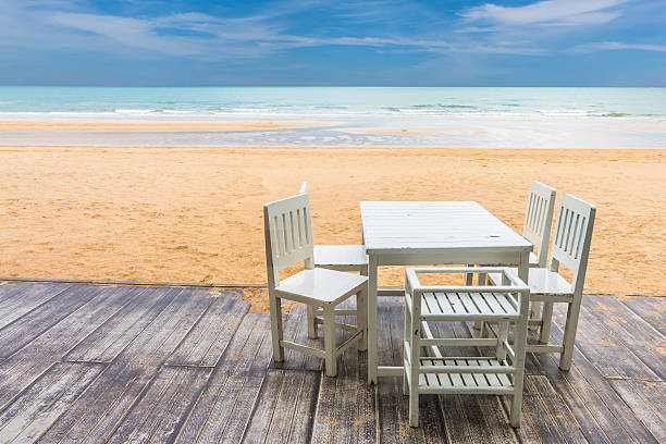 istock wood floor and seaside table with beach and sea background 626144356