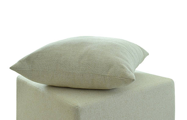 istock Off-white pillow on stool in modern interior isolated on white 626144582