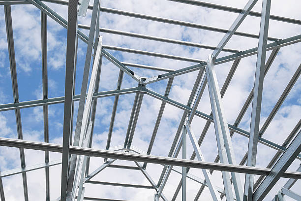 istock Structure of steel roof frame with blue sky and clouds 626145446