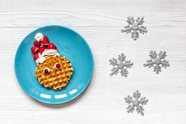 istock breakfast for child on Christmas with waffle top view 626151592