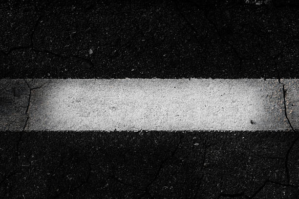 istock Crack asphalt the white line background. 626153928