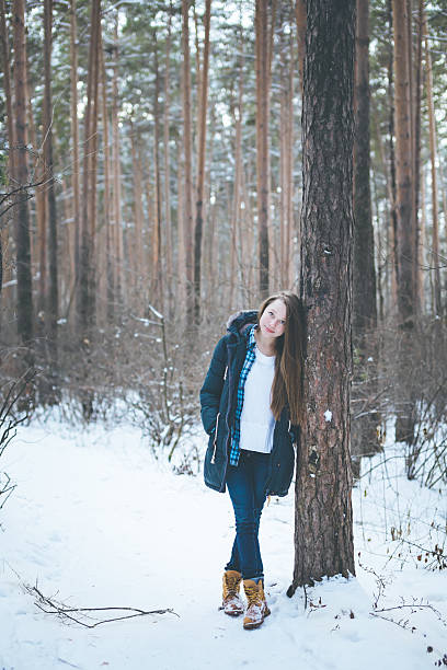 istock Natural young woman in winter forest 626156086