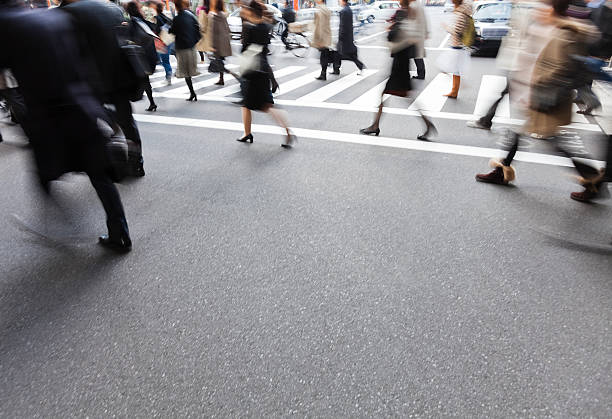 istock People on a crosswalk with a blur motion 626156442