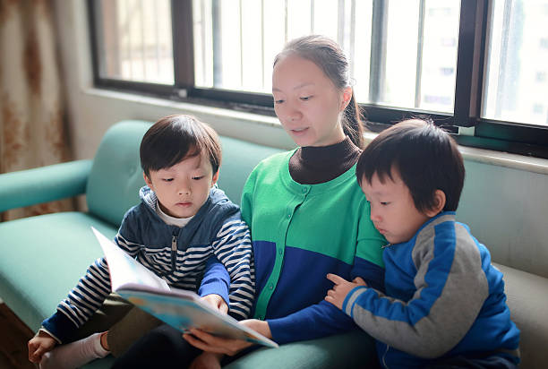 istock Reading a Book Together as a Family 626158590