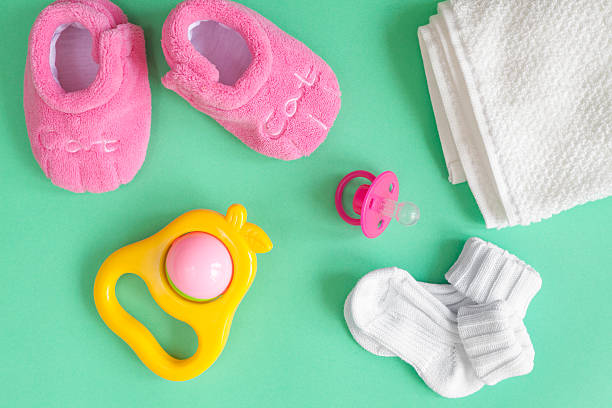 istock children's clothes and baby booties on green background 626158794