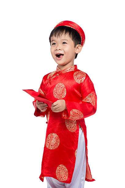 istock Vietnamese boy in red traditional clothes holding red envelope 626160350