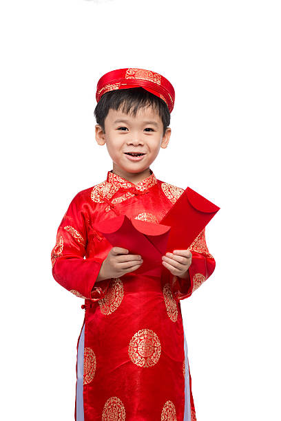 istock Adorable Vietnamese boy holding red envelops for Tet 626161000