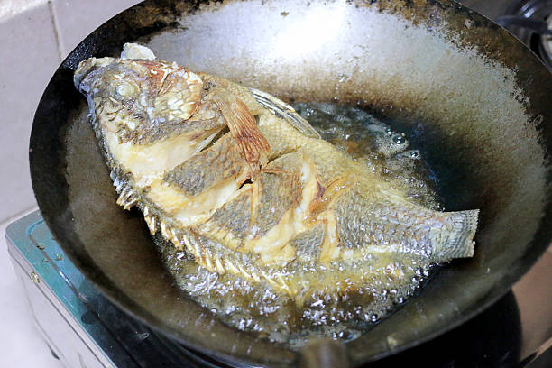 istock Fried fish in a frying pan in the kitchen 626161100