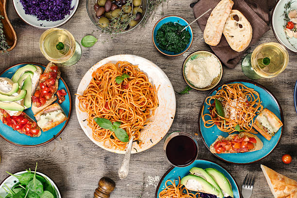 istock Italian pasta with tomato sauce with snacks and wine 626161268