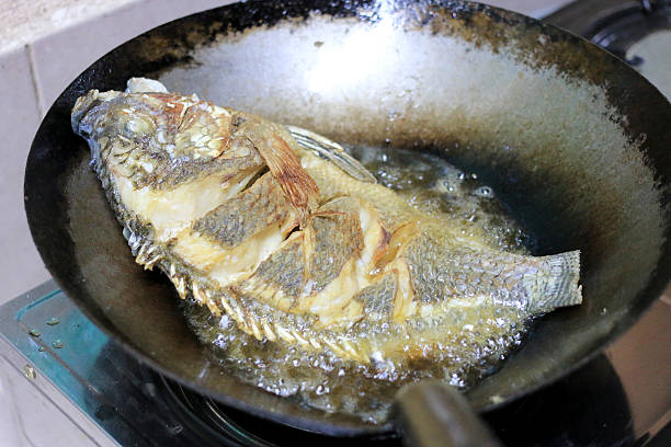istock Fried fish in a frying pan in the kitchen 626161362