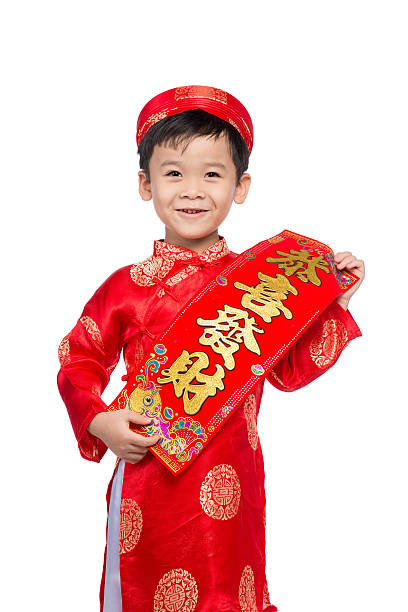 istock Vietnamese Boy Kid showing red couplets 626161610