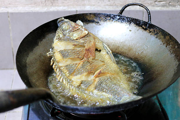 istock Fried fish in a frying pan in the kitchen 626161648