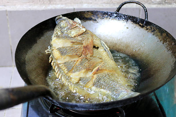 istock Fried fish in a frying pan in the kitchen 626161904