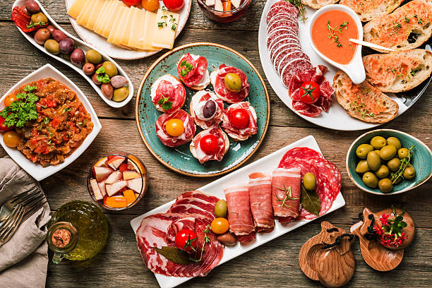 spanish tapas and sangria spanish tapas and sangria on wooden table, top view tapas photos stock pictures, royalty-free photos & images