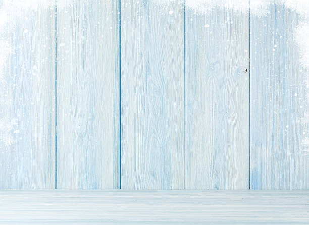 istock Christmas wooden background with snow 626172110