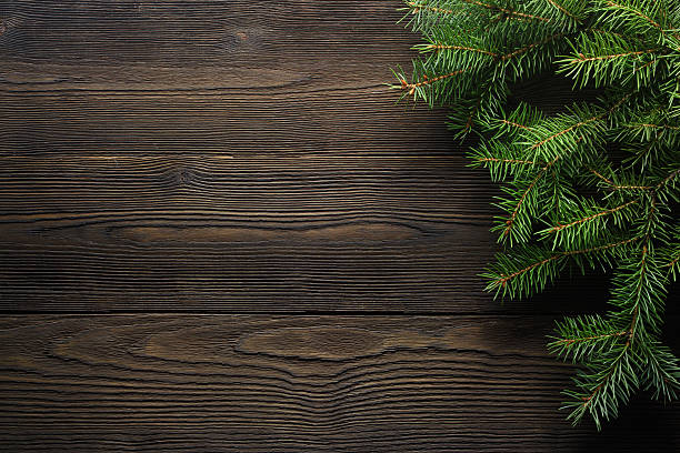christmas wooden background with fir tree - piek kerstversiering stockfoto's en -beelden