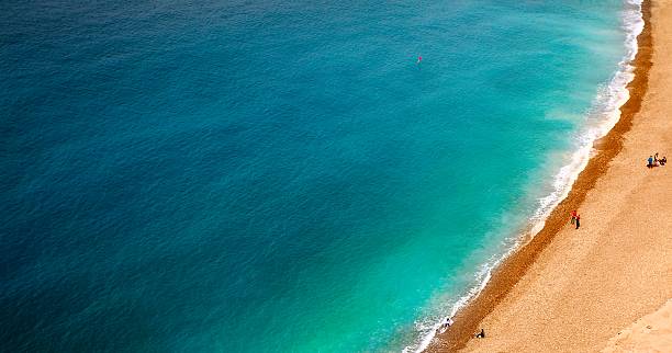 istock wave of blue sea on sandy beach. 626175008