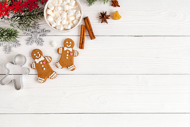 istock Christmas gingerbread, spruce branches on wooden background top view 626176220