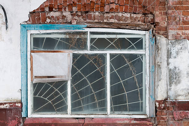 istock Broken window in an old Russian building 626177874
