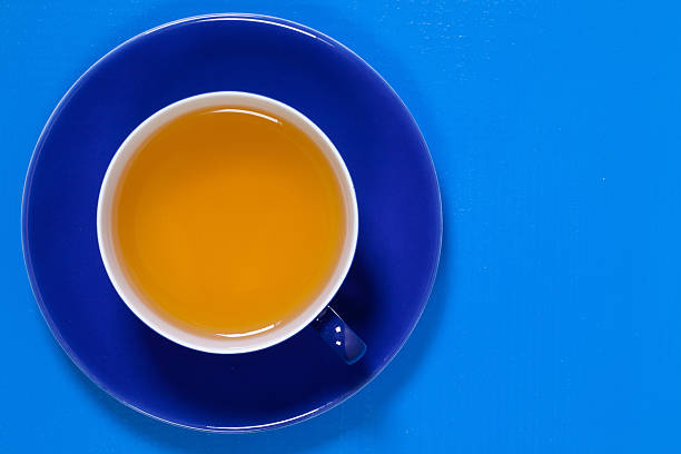 istock Perfect cup of tea on blue wooden table 626183150