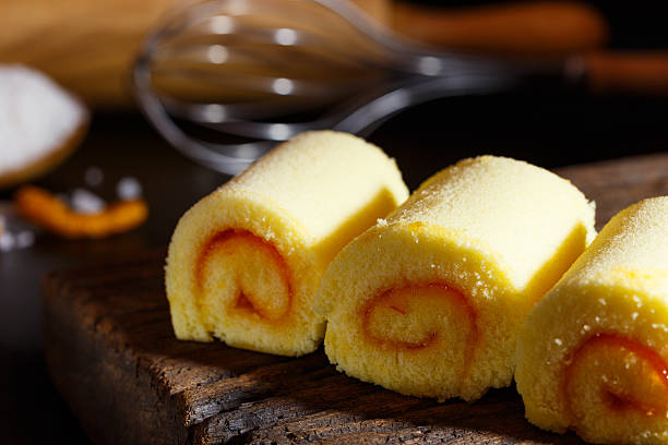 istock Yamroll orange on wood plate and black background 626183466