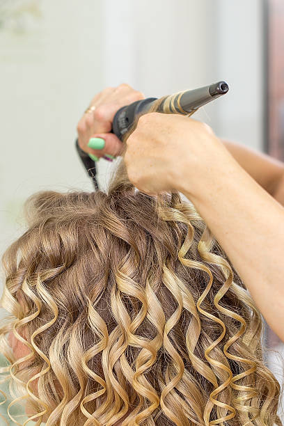 istock Hair stylist makes the bride before wedding. 626183924