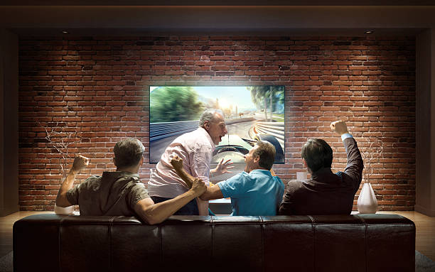 istock Adults watching Car sprint at home 626185180