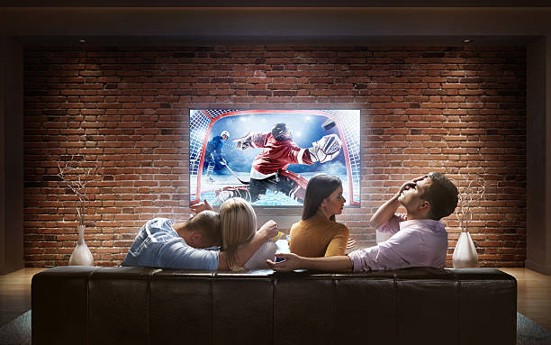 istock Couples watching Ice Hockey game at home 626185668