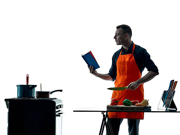 istock man cooking chef silhouette isolated 626186670