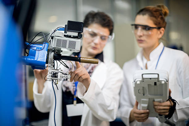 istock Female engineers conducting robotic arm 626186822