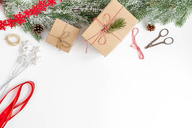 istock packaging christmas gifts in boxes on white background top view 626187672