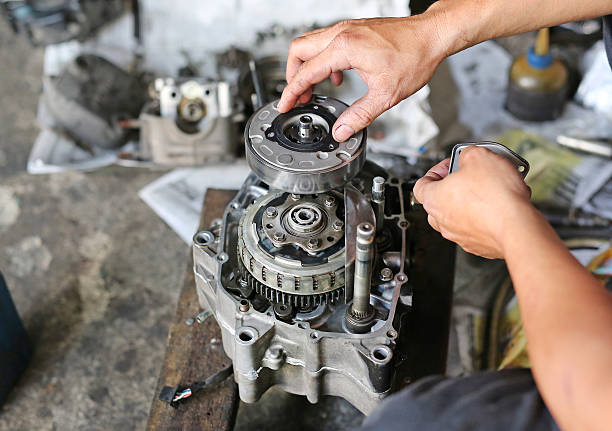 istock pair of technician hand fixing the motorcycle 626194870
