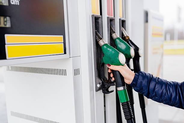 istock Woman holding a fuel nozzle 626194938
