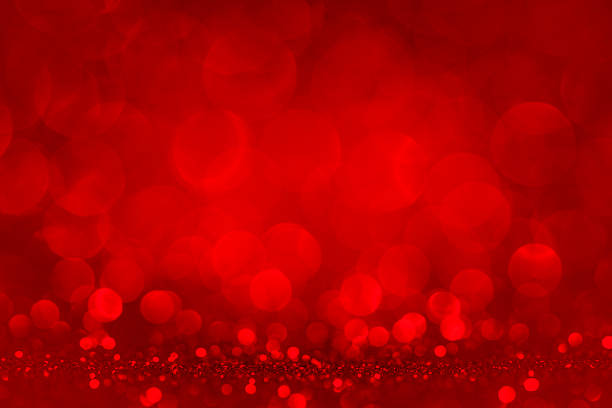 Defocused red lights and glitter stock photo